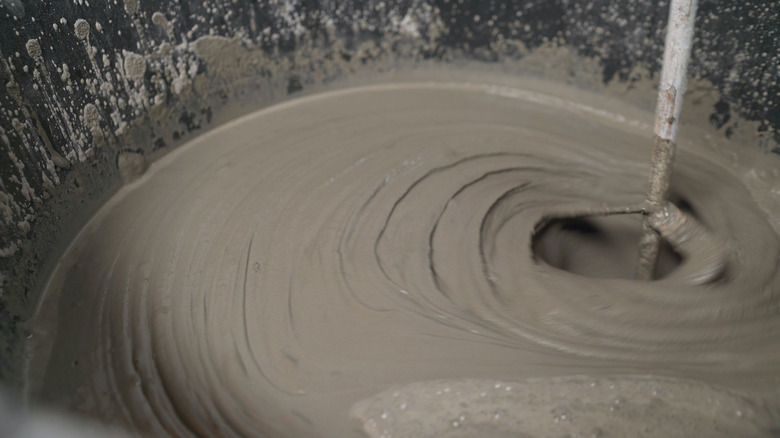 mixing grout in bucket 