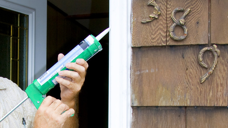 Caulking a door