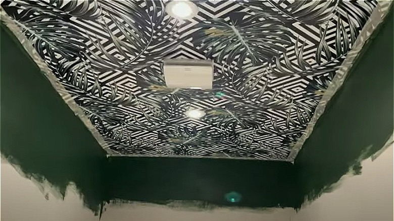 wallpapered ceiling with green walls