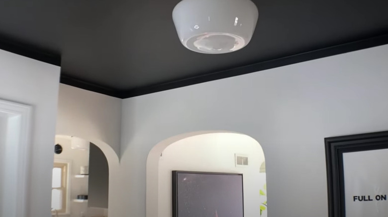 black ceiling with white walls