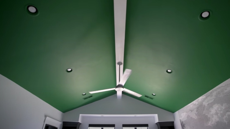 green ceiling with white fan