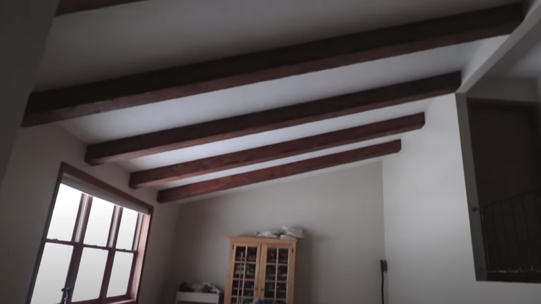 wooden beams along slanted ceiling