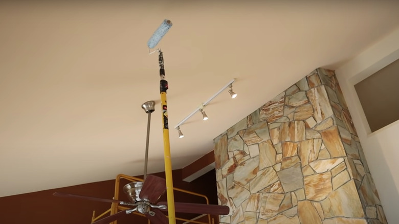 tan ceiling with stone fireplace