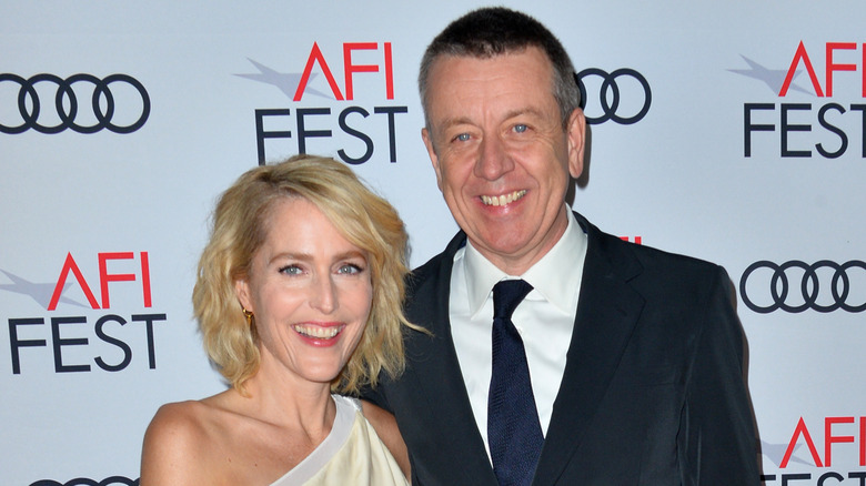 Gillian Anderson and Peter Morgan smiling