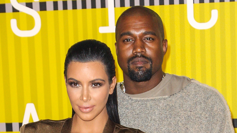 Kim Kardashian and Kanye West yellow background