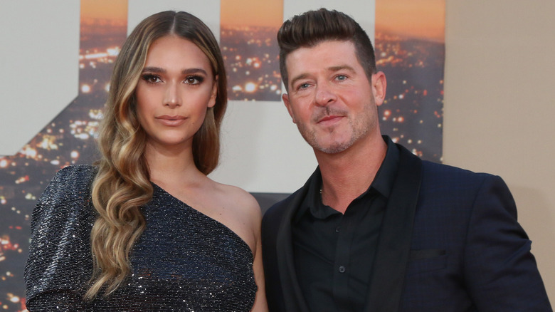 Robin Thicke and is wife posing