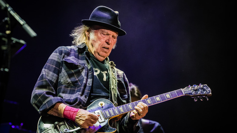 Neil Young playing guitar 