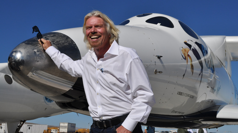 Richard Branson in front of jet 