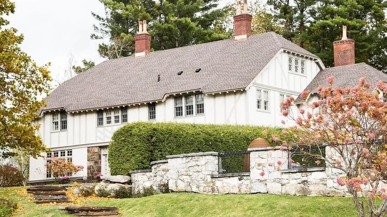 white wooden manor stone fence