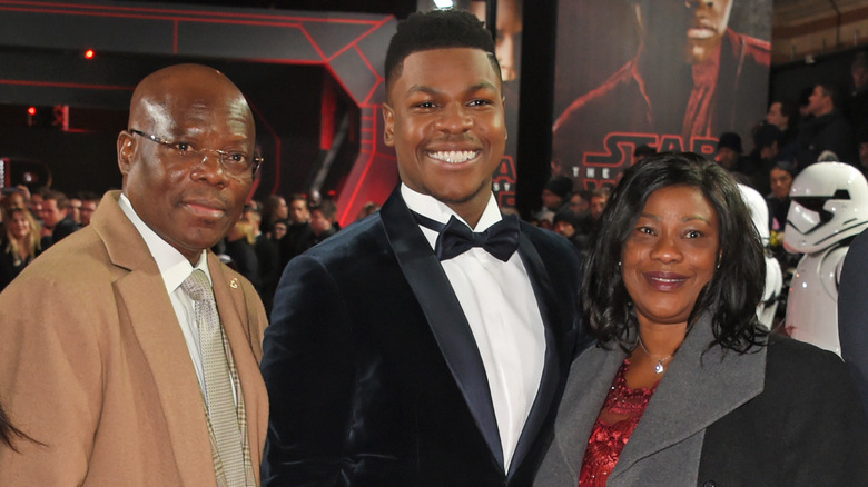 John Boyega and parents red carpet
