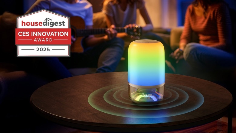 Govee table lamp on a wood table with people around it sitting on sofa