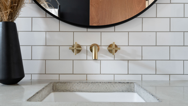 A sink with brass hardware