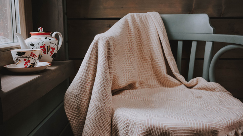 blanket on the back of a chair