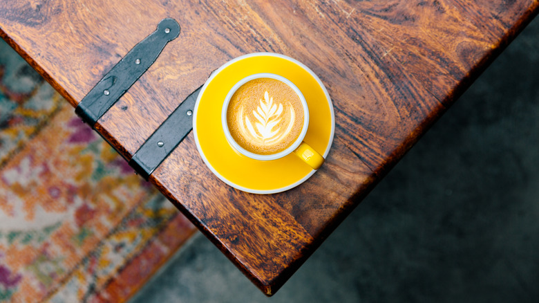 sharp corner of coffee table with cup