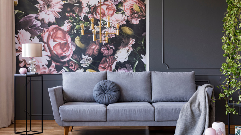 floral wall design and sofa