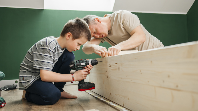 Father and son building furniture