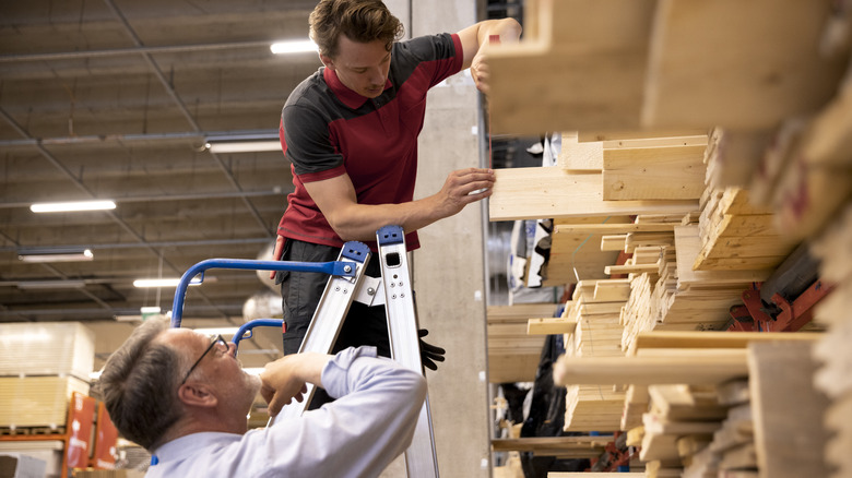 People shopping for lumber