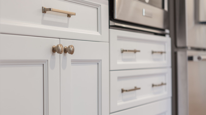 Gold hardware on white cabinets