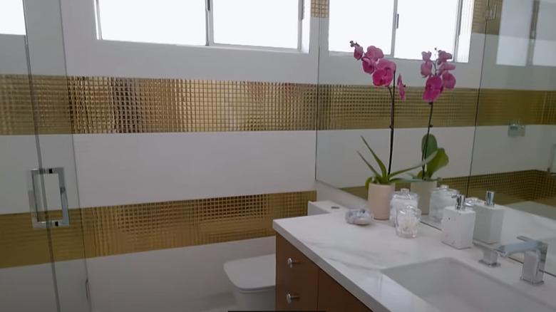 bathroom with gold tile