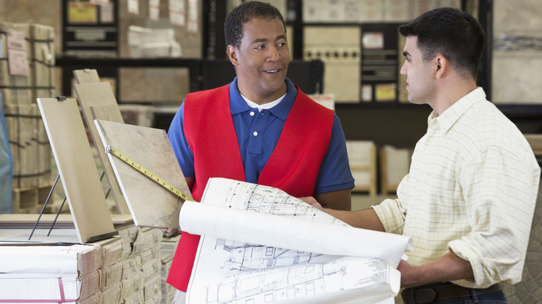 work and contractor picking out supplies