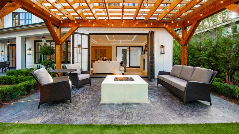 fire pit under cedar pergola