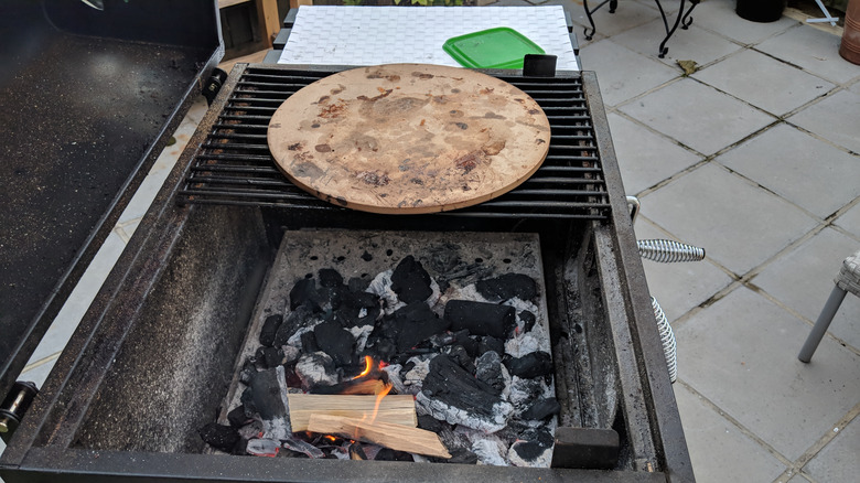 Dirty pizza stone on BBQ