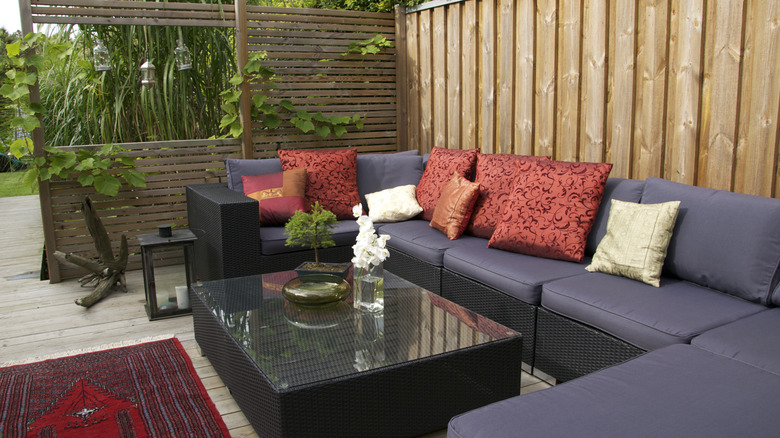 Outdoor sectional with navy blue cushions