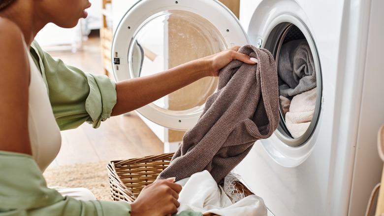 person removing items from dryer