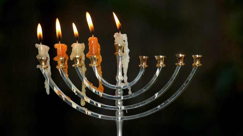 melted candles on Menorah