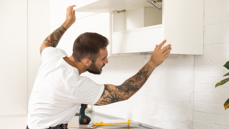 Installing kitchen cabinets