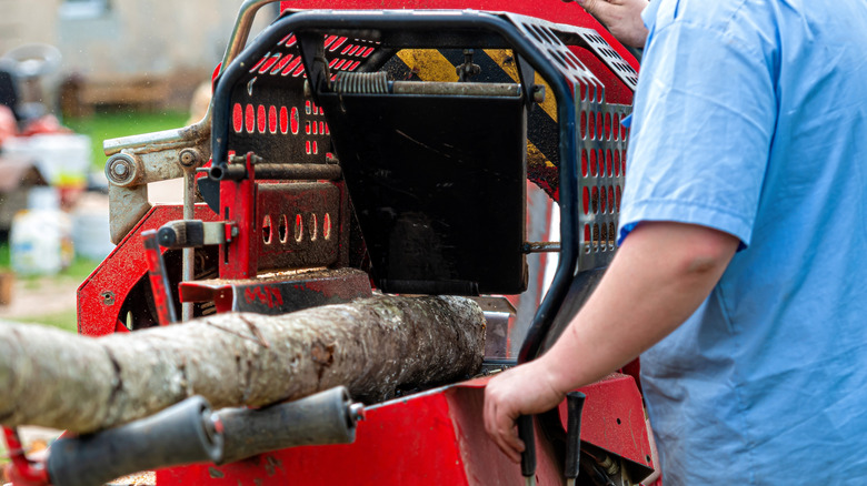 log in wood chipper