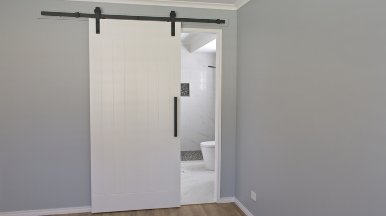 sliding barn door into bathroom