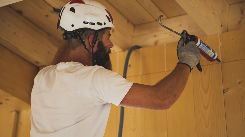 Relieving pressure with caulk gun lever