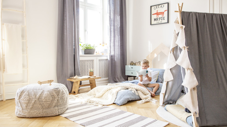 boy and floor pillow