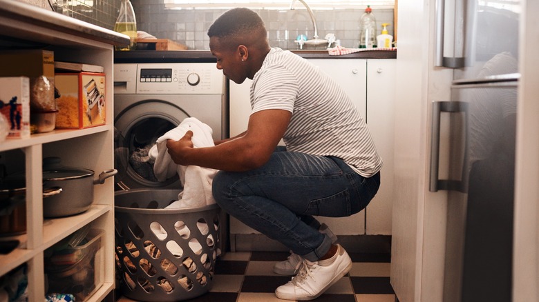 man doing laundry