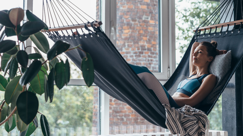 woman on hammock in home