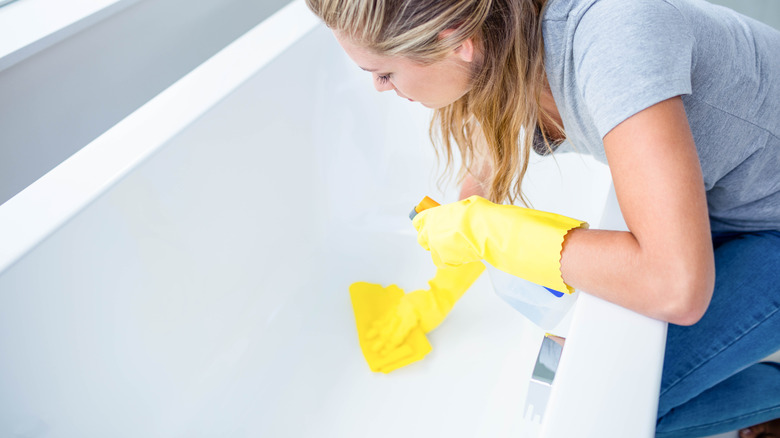 woman cleaning tub