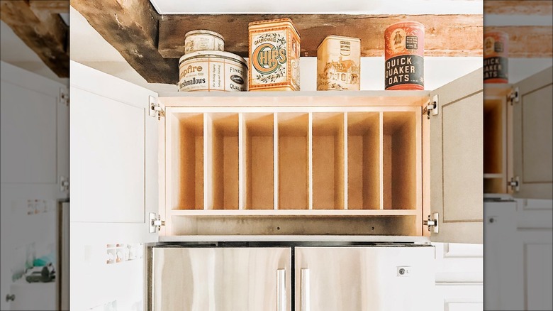 Vintage food tins above cabinets