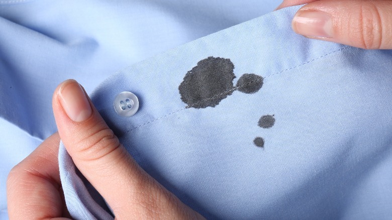 Ink stain on blue shirt