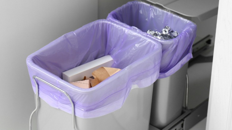 Trash and recyclng cans with purple liners