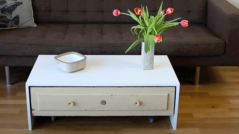 white coffee table with flowers