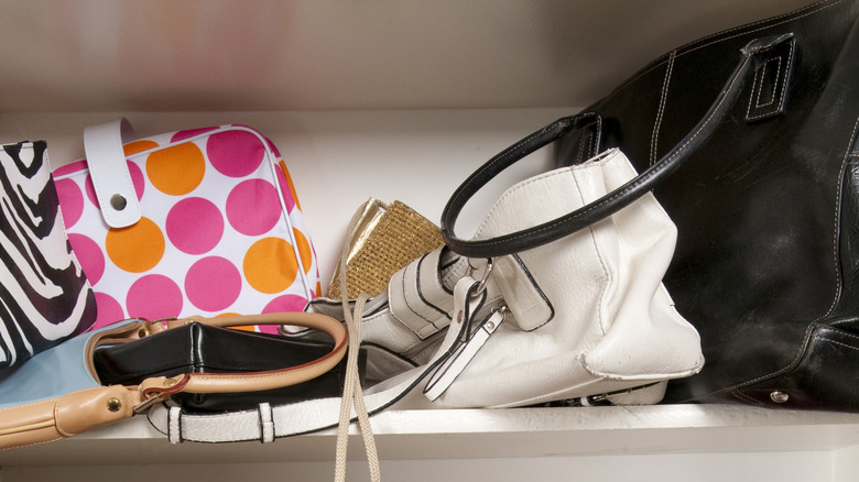 purses stored on shelf in closet