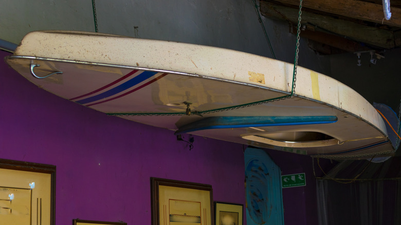 old kayak suspended from ceiling