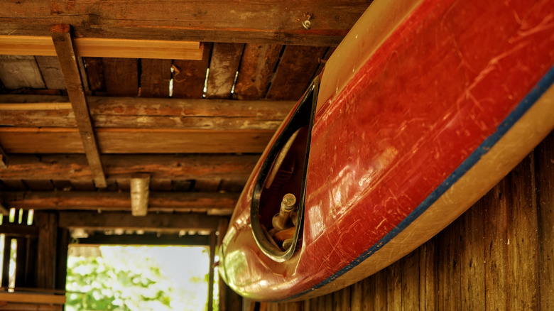Kayak stored on barn wall