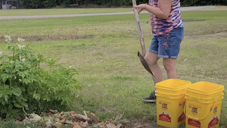 woman gardening with litter containers