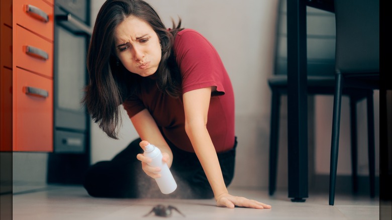 woman spraying bug