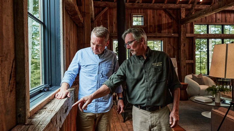 Clint Harp admiring wood