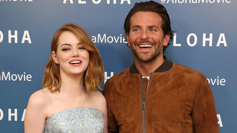 Emma Stone and Bradley Cooper at a premier