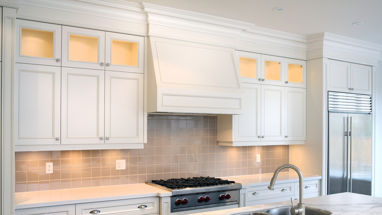 Wall mounted white kitchen cabinets