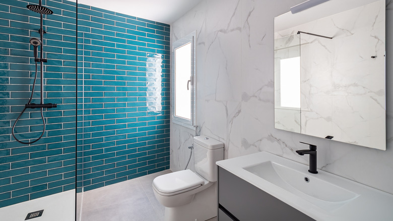 Bathroom with accent tile wall